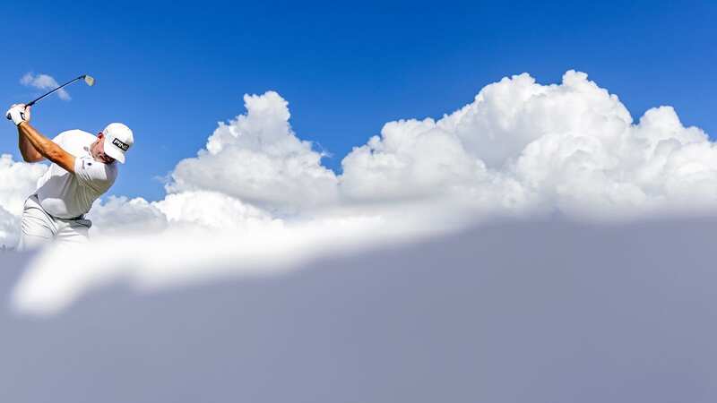 This heavenly image of English golfer, Lee Westwood, seemingly among the clouds, was the overall winner of the World Sports Photography Awards 2023 (Image: Patrick Smith/Cover Media)