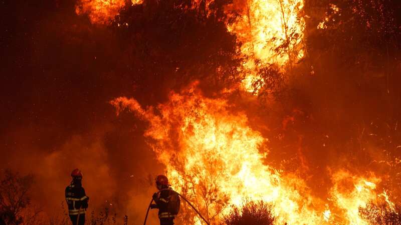 Hundreds of tourists have been caught up in the terrifying flames (Image: LUIS FORRA/EPA-EFE/REX/Shutterstock)