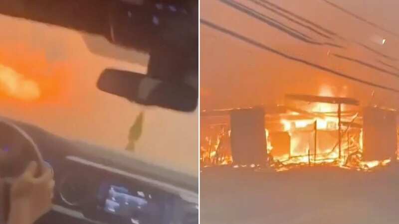 Apocalyptic scenes as families drive through inferno island engulfed by flames