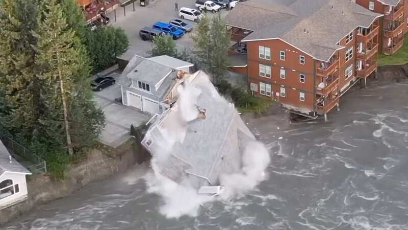 Entire house collapses in swollen river as heartbroken family searches for cat