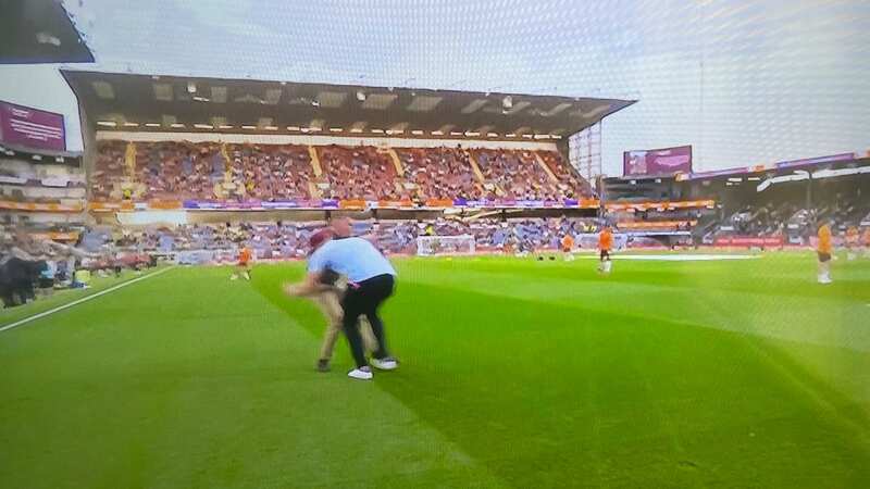 Jamie Carragher was tackled by JJ Watt before Burnley vs Man City (Image: Sky Sports)
