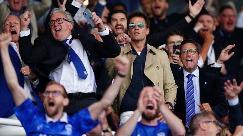 Birmingham City CEO Garry Cook and co-owner Tom Brady celebrate the team