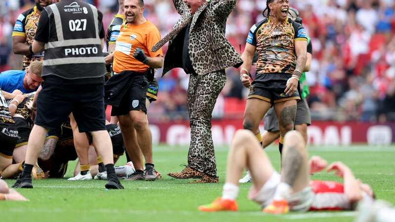 Leigh Leopards owner Derek Beaumont (centre)joins in with the players celebration after Lachlan Lam