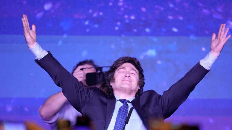 Javier Milei, the presidential candidate of the Liberty Advances coalition, smiling at his campaign headquarters after polling stations closed (Image: AP)