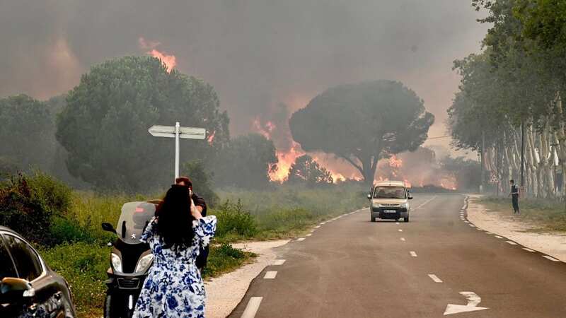 France wildfires rip through homes and campsite as thousands of tourists flee