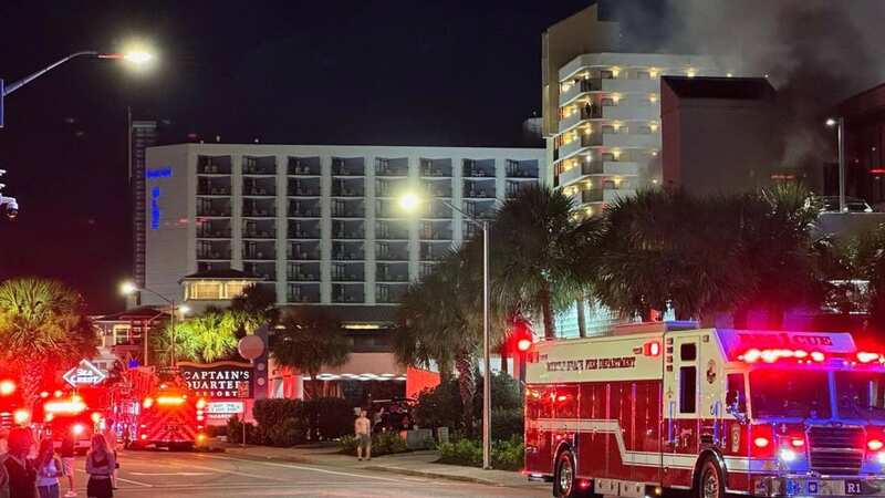 Dramatic photographs show hotel ablaze as holidaymakers evacuated over huge fire
