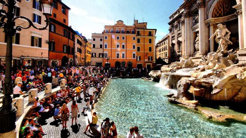 A woman was filmed clambering into the iconic fountain (Image: Getty Images)