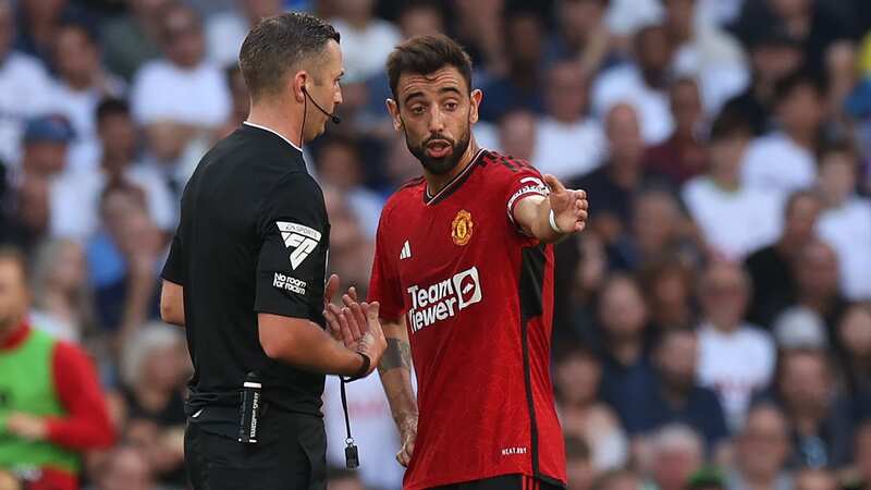 Manchester United captain Bruno Fernandes and referee Michael Oliver (Image: Matthew Peters/Manchester United via Getty Images)