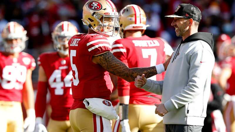 LAS VEGAS, NEVADA - AUGUST 13: Quarterbacks Sam Darnold #14 and Trey Lance #5 of the San Francisco 49ers look on from the sideline while head coach Kyle Shanahan of the San Francisco 49ers walks by during the fourth quarter during a preseason game against the Las Vegas Raiders at Allegiant Stadium on August 13, 2023 in Las Vegas, Nevada. The Raiders defeated the 49ers 34-7. (Photo by )
