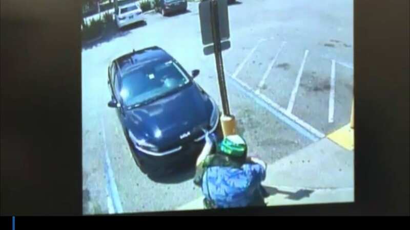 Evil mass shooter shown on CCTV beginning racist murder spree at store