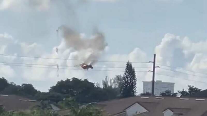 Terrifying moment burning helicopter spins out of control and plunges into home