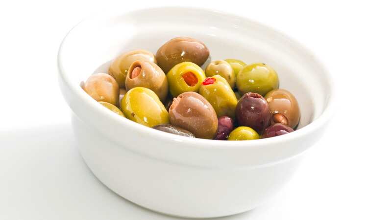 Olives are packed with Vitamin E, antioxidants, low in calories, and are a great source of good fats (stock photo) (Image: Getty Images)