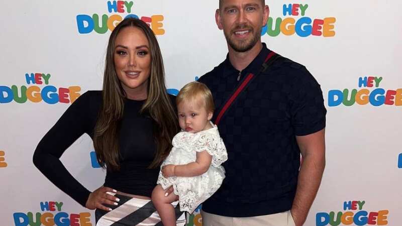 Charlotte posed alongside her partner Jake and adorable daughter Alba