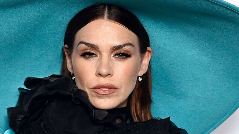 Billie Piper turns heads as she poses on red carpet with dramatic hat