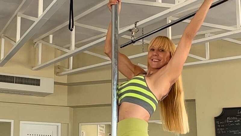 She now makes a living as a pole fitness star in her 50s (Image: @kerrygoldfitness / CATERS NEWS)