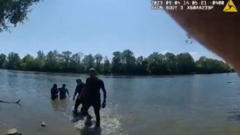 Heroic officer rescues father and daughter after truck plunges into river