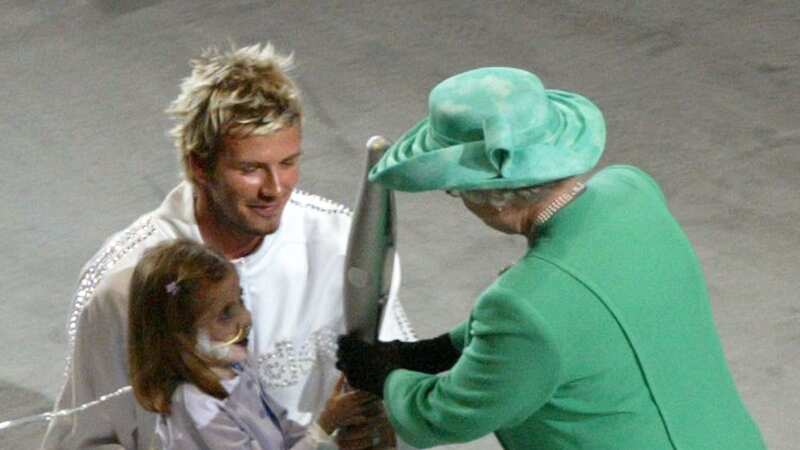 David Beckham met Elizabeth II in 2002 (Image: Getty Images)