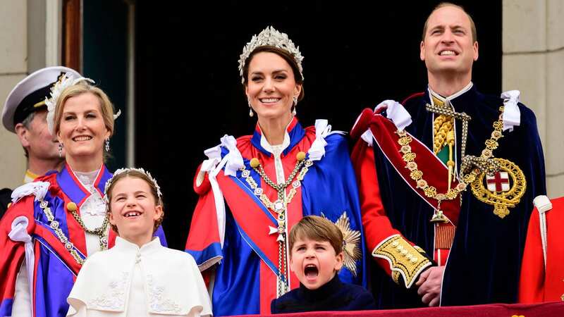 Princess Charlotte and Prince Louis are pictured on the balcony of Buckingham Palace during the coronation of Britain