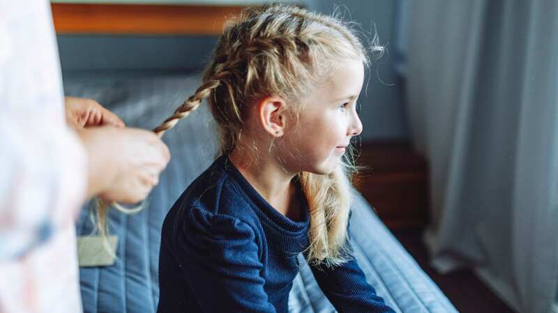 Her tender scalp and tangly hair was a sore spot (stock photo) (Image: Getty Images)