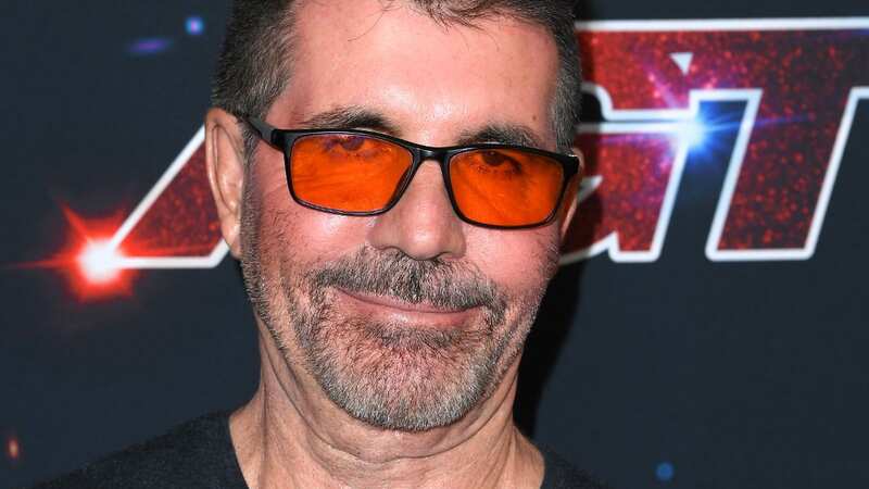 Simon Cowell has embraced a brand new look, ditching his signature black sunglasses for a more vibrant pair of orange shades in Los Angeles on Tuesday. (Image: FilmMagic)