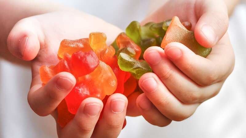 A boy sharing gummies or candies (Image: Roberto Machado Noa/LightRocket via Getty Images)