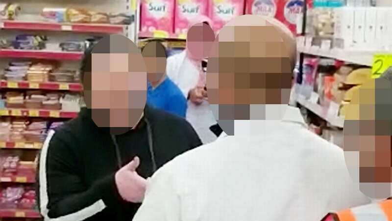 Suspected shoplifter argues with a member of staff (Image: Birmz Is Grime / SWNS)