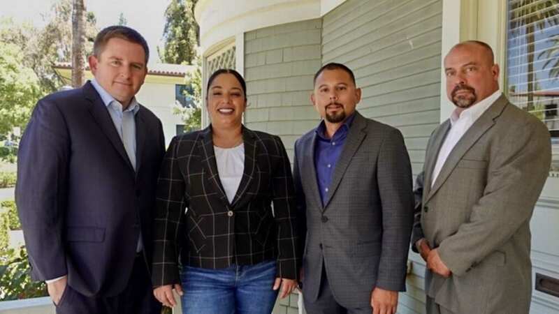 Izquierdo and her legal team pose for a photo after she won a major legal battle related to a shooting (Image: Andy Beltran)
