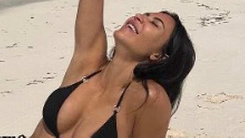 Kim Kardashian is living her best life in the tiniest string bikini