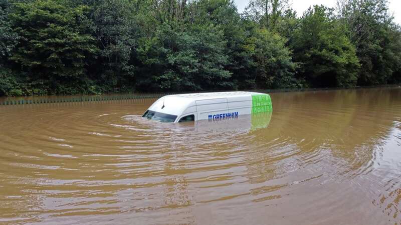 Heavy rain sparks horror floods across Britain with van stuck underwater