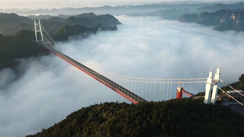 New footage shows a man swinging from the Aizhai Suspension Bridge in China (Image: Visual China Group via Getty Images)