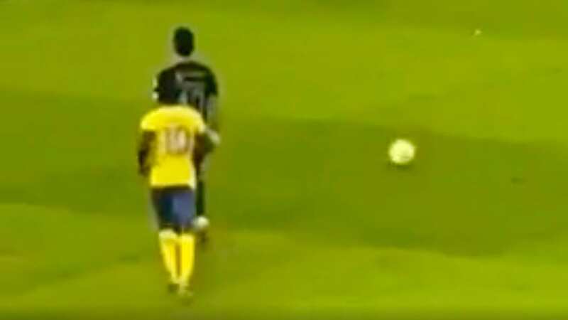 Sadio Mane jumps on the back of Roberto Firmino
