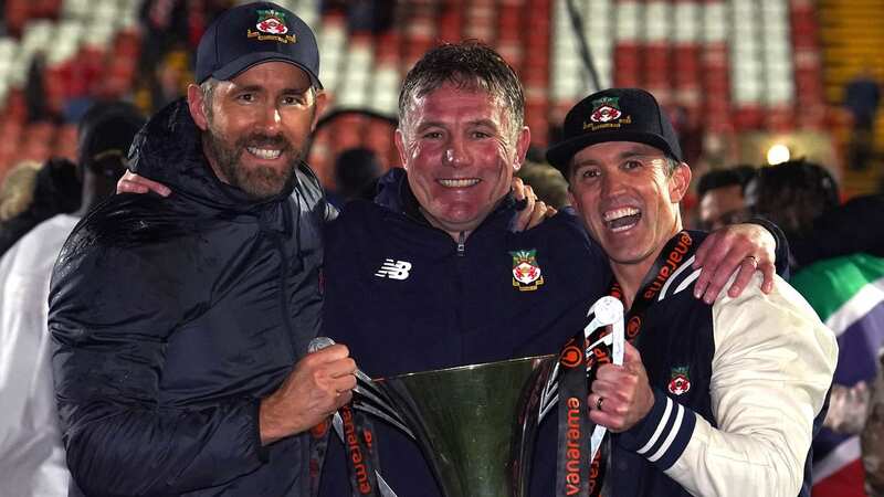 Wrexham co-owners Ryan Reynolds and Rob McElhenney and manager Phil Parkinson combined to help the club eventually gain promotio (Image: Martin Rickett/PA Wire.)