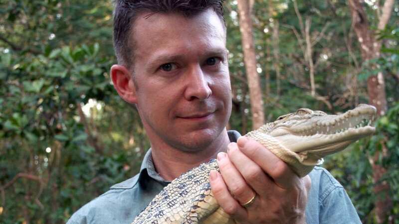 Adam Britton with a young crocodile before he was caught for his crimes (Image: Big Wave Productions Ltd)