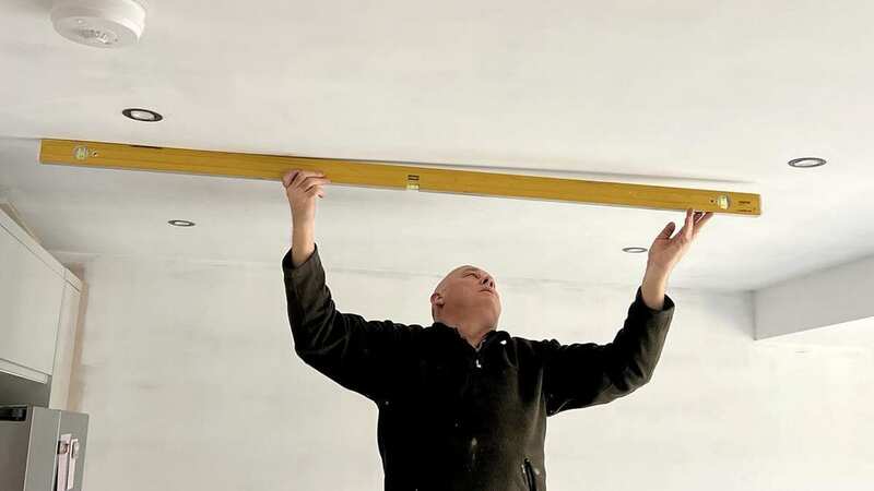 Ceilings in Louisa and Edwards home in Wiltshire were left uneven (Image: Louisa Benton / SWNS)
