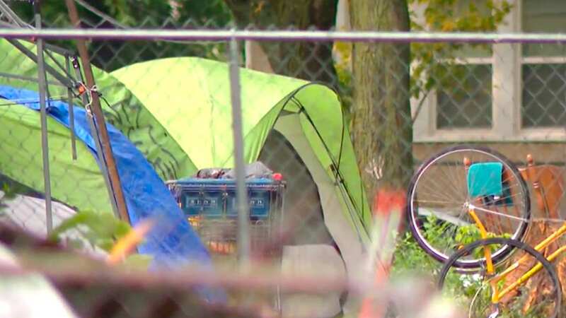 An encampment is sprawling through a man