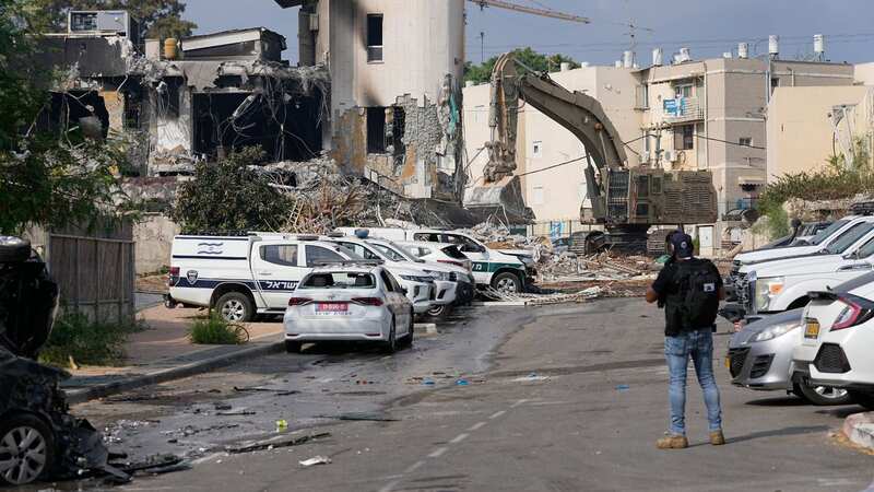 A digger removes the rubble from the police station that was overrun by Hamas militants on Saturday, in Sderot, Israel (Image: AP)