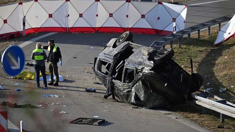 Police attendants stand by an overturned vehicle on highway near Muehldorf, Germany (Image: AP)