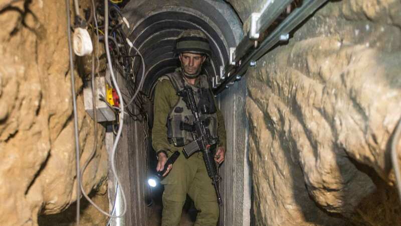 An Israeli army officer gives journalists a tour of a tunnel allegedly used by Palestinian militants for cross-border attacks (Image: AP)