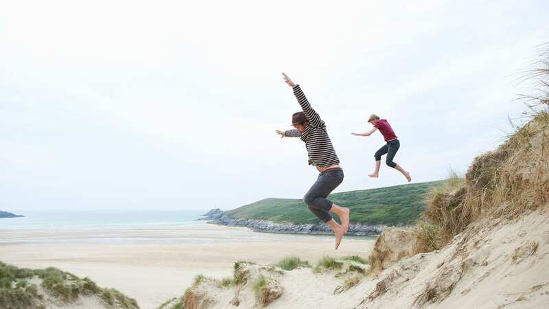 Get ready to jump into Spring with low-cost British beach breaks (Image: Getty)