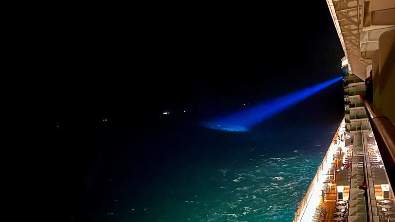 A searchlight from the Iona scouring the water for the lost crewmen (Image: PA)