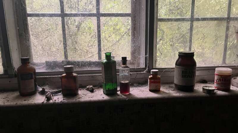 The poisoned bottle sitting on the shelf in the abandoned home (Image: mediadrumimages/@TheDerelictQueen)