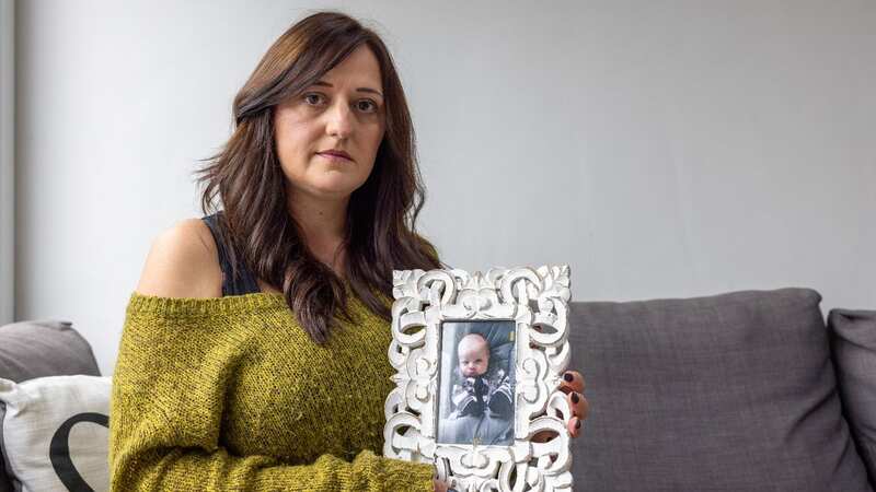 Mum Vicky with a photo of her beloved son (Image: Martin O