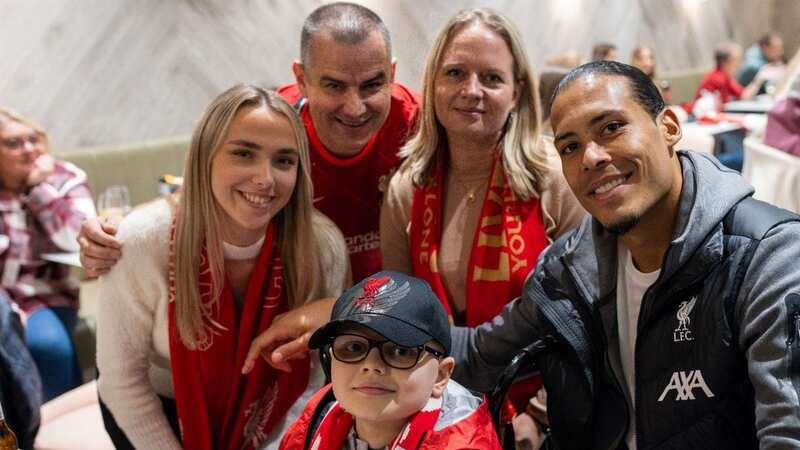 Harry Mills, nine, with Virgil van Dijk after the Merseyside derby (Image: Andy Mills)
