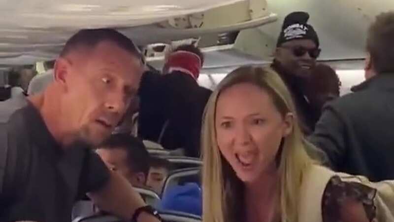 The woman was livid while the man behind tried to reason with her (Image: TikTok)