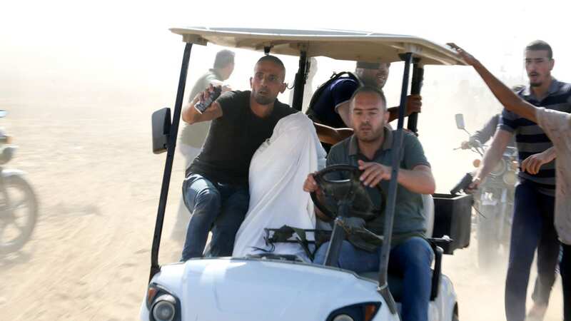 Palestinians abducting an Israeli citizen from a Kibbutz (Image: AP)