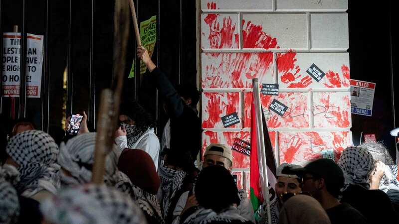 Part of the White House was covered with red paint resembling blood (Image: AFP via Getty Images)