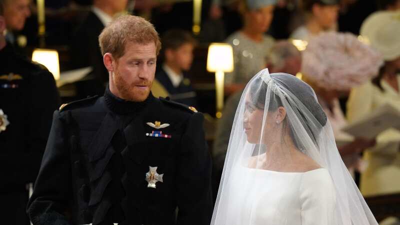 Harry on his wedding day walking with William (Image: Getty Images)