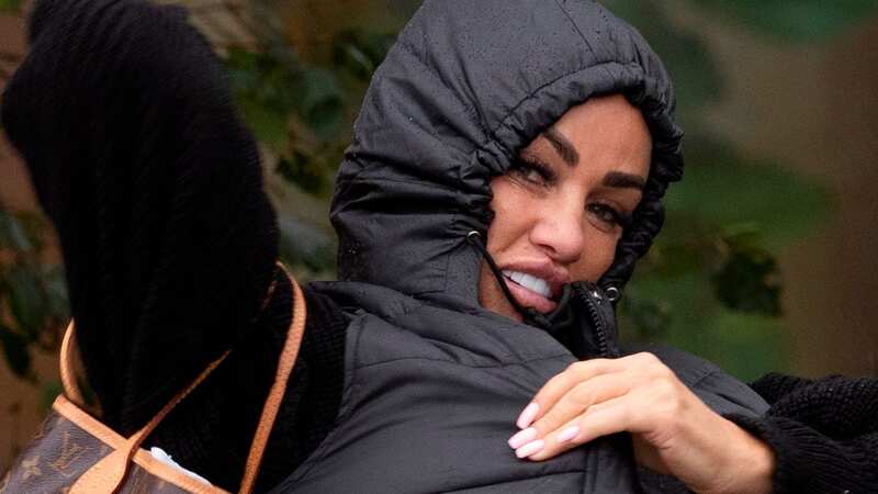 Katie Price was seen checking out of a budget hotel after filming her podcast show (Image: SplashNews.com)