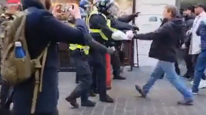 Moment far-right thugs attack police in London as mass brawl breaks out
