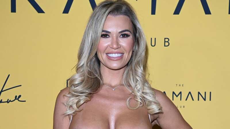 Christine McGuinness risks baring all in plunging dress with thigh-high split